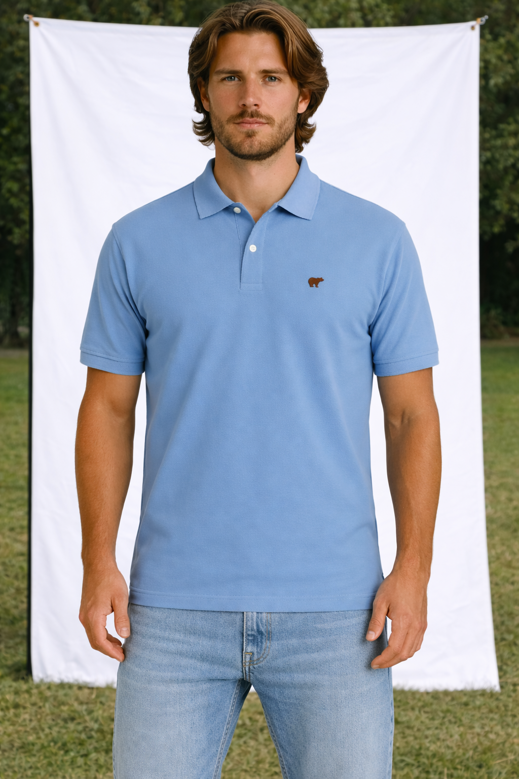 Polo azul bordada azul